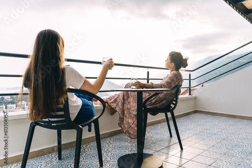 Two young girlfriends enjoy a beautiful view