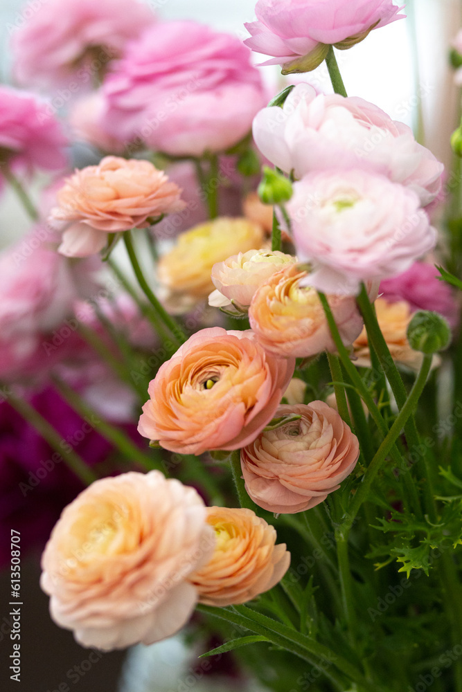 Fototapeta premium The process of creating a floral composition. Composition from kenzan. Floristic courses. Study of floristry. Rest and relaxation while creating bouquets from farm flowers.