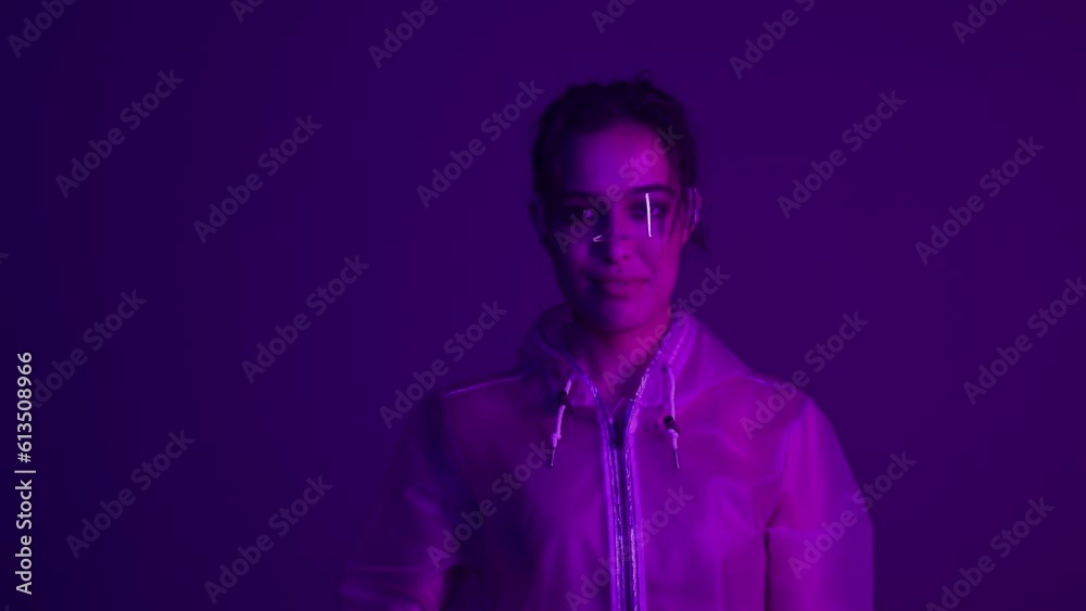 Woman in futuristic costume. Girl in glasses of virtual reality while touching air. Augmented reality game, future technology, AI concept. VR. Neon blue and red light. Dark background. Woman in futuristic costume. Girl in glasses of virtual reality while touching air. Augmented reality game, future technology, AI concept. VR. Neon blue and red light. Dark background.