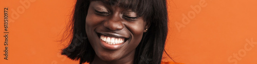Young beautiful smiling african woman with closed eyes