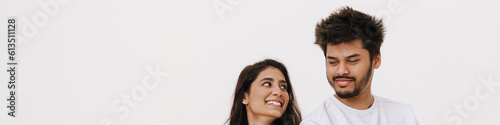 East asian young man and woman smiling and posing at camera