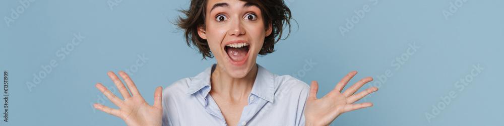 White excited woman wearing shirt expressing surprise at camera White excited woman wearing shirt expressing surprise at camera