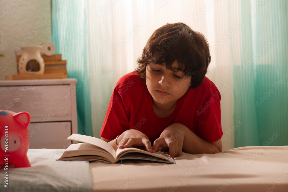 Portrait of a little boy reading a book Portrait of a little boy reading a book