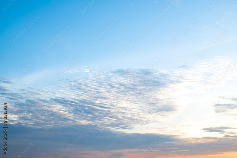 beautiful , luxury soft gradient orange gold clouds and sunlight on the blue sky perfect for the background, take in everning,Twilight beautiful , luxury soft gradient orange gold clouds and sunlight on the blue sky perfect for the background, take in everning,Twilight