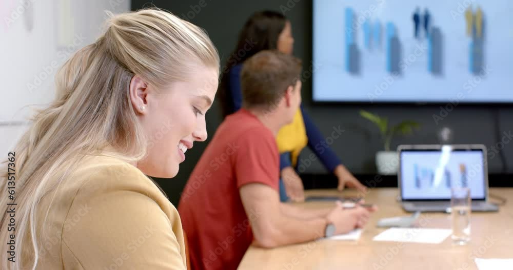 Happy caucasian casual businesswoman talking in meeting with diverse colleagues, slow motion Happy caucasian casual businesswoman talking in meeting with diverse colleagues, slow motion