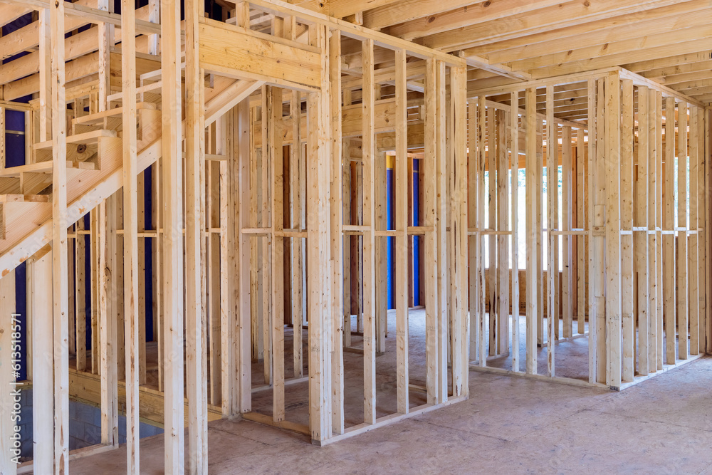 During construction of new house, wooden beams serve as support within frame During construction of new house, wooden beams serve as support within frame