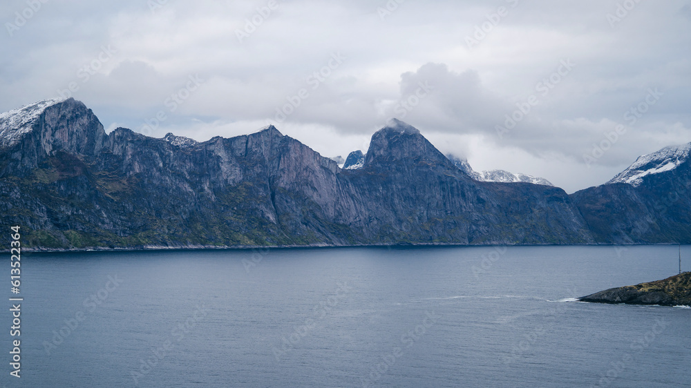 Rainy clouds over a fjord on Senja island in Norway