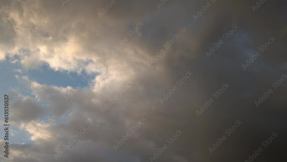 Giant golden cumulus expands across the sky and turns even more golden at sunset Giant golden cumulus expands across the sky and turns even more golden at sunset