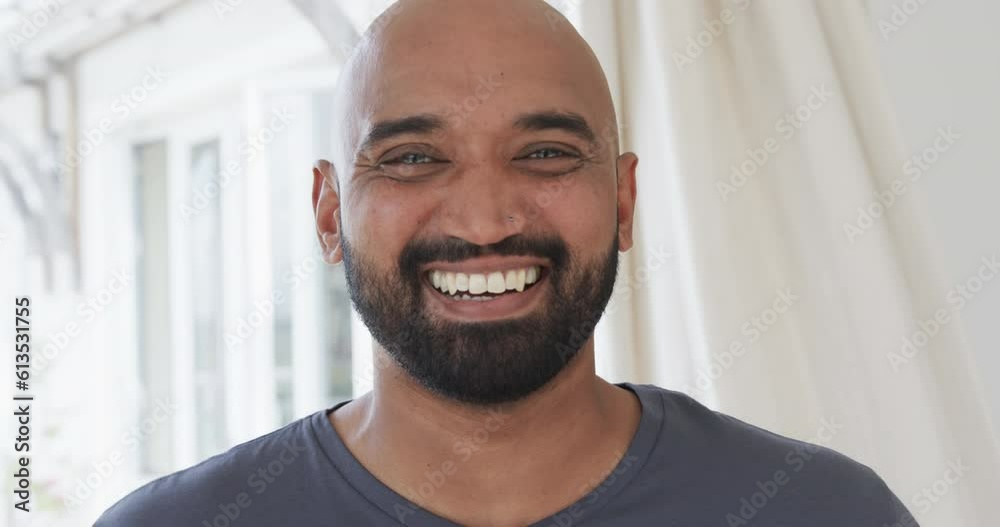 Portrait of happy biracial man at home, slow motion Portrait of happy biracial man at home, slow motion