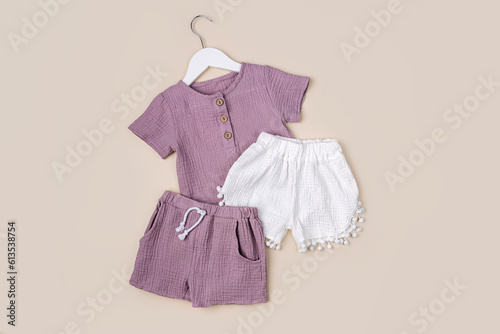 Cotton shirts with shorts. Stylish baby clothes and accessories for summer. Fashion kids outfit. Flat lay, top view