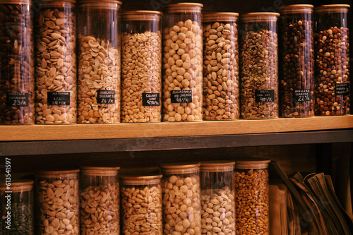 A bountiful bulk store display: labeled containers filled with diverse, nutritious dried fruits
