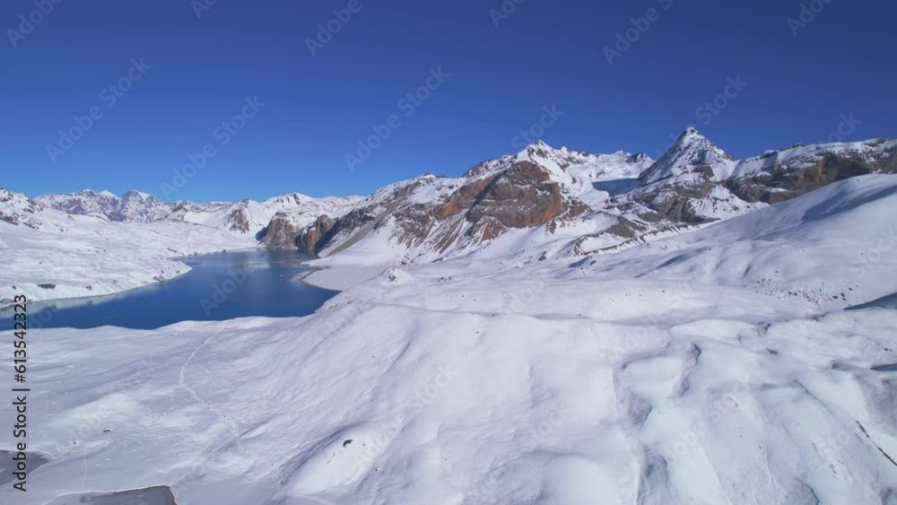 Aerial birds eye view scenic breathtaking panorama of beautiful blue Tilicho lake in high altitude Himalayas mountain range. Tilicho lake trail route, Nepal Aerial birds eye view scenic breathtaking panorama of beautiful blue Tilicho lake in high altitude Himalayas mountain range. Tilicho lake trail route, Nepal
