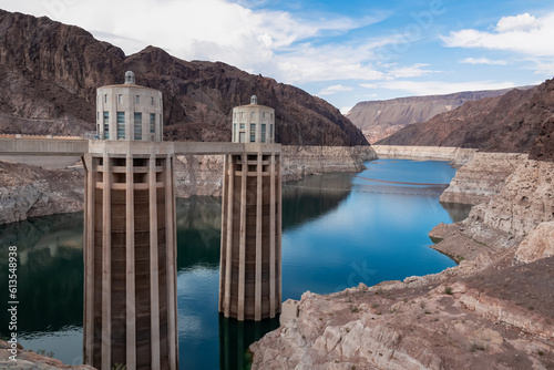 Scenic view of the wall of Hoover Dam next to Tillman Memorial Bridge, Nevada Arizona state line, USA. Renewable energy plant in Lake Mead National Recreation Area near Las Vegas. River reflection photo