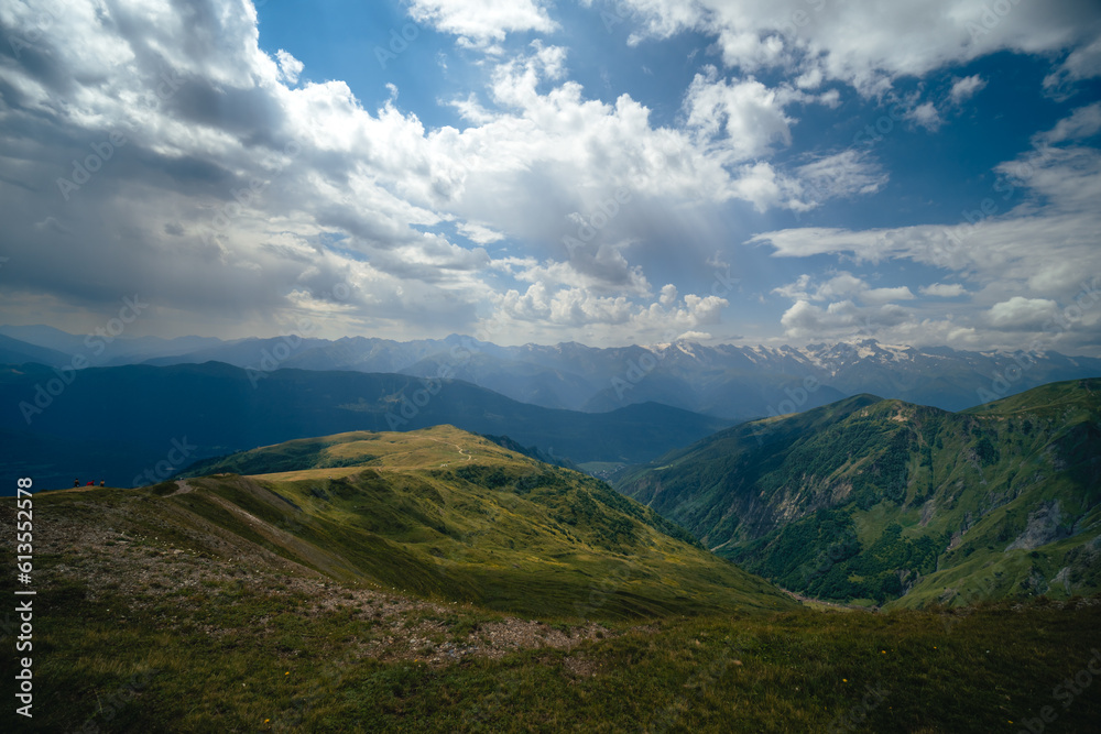 View of mountain tops, warm summer day, clouds in the sky, way to Ushba mountain and Koruldi lakes. Concept of vacation and travel to Georgia. Nature, Mestia, Svaneti mountains