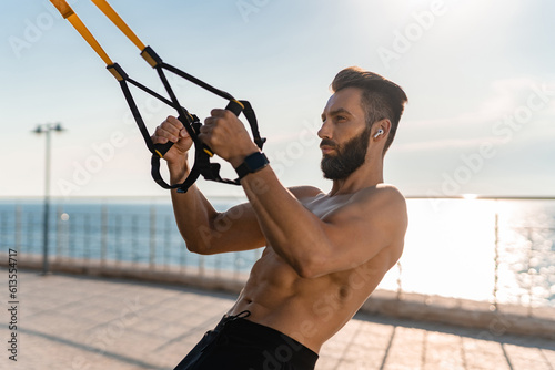 attractive hansome man shirtless with athletic strong body on morning fitness workout exercise