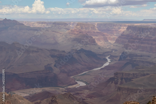 Panoramic aerial view seen from Desert View Point at South Rim of Grand Canyon National Park, Arizona, USA, America. Colorado River weaving through valleys and rugged terrain. Natural world wonder
