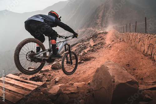 Cyclist in the mountains, practicing Enduro MTB.