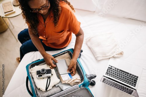 Travel planning and packing  Woman getting ready for an overseas trip