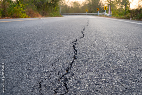 Broken asphalt roads, caused by sub-standard construction, corruption