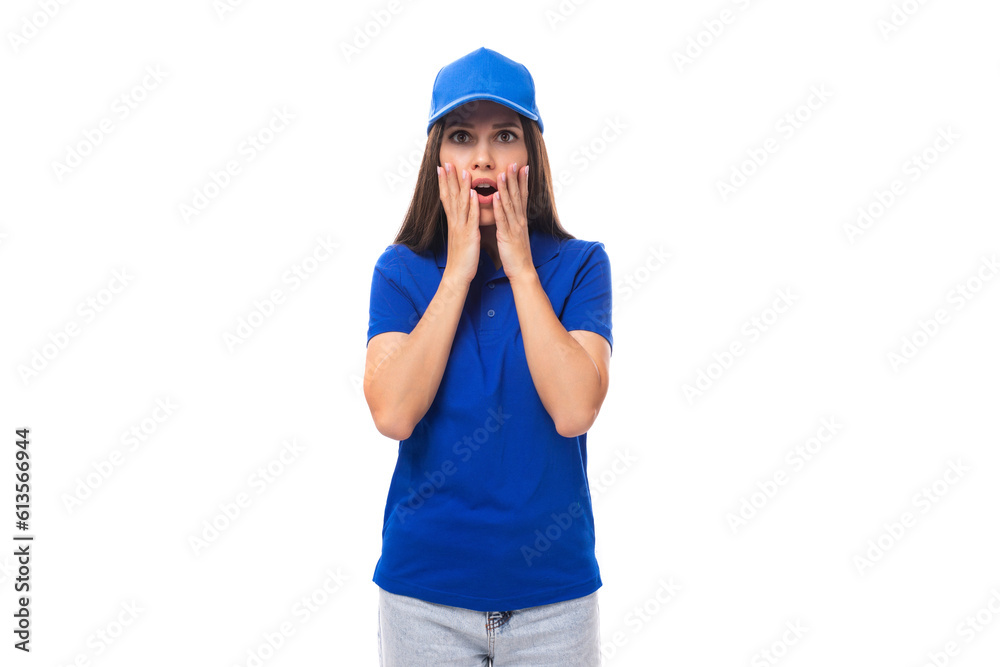 surprised young woman promoter in blue t-shirt and cap on white background with copy space