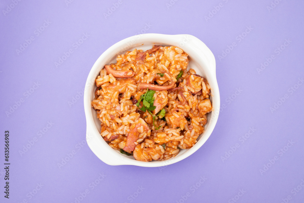 Typical portuguese dish rice with octopus in bowl Typical portuguese dish rice with octopus in bowl