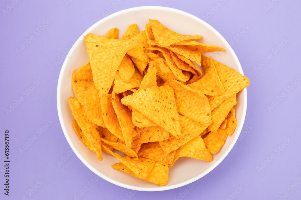 plate of corn chips nachos with guacamole on plate plate of corn chips nachos with guacamole on plate