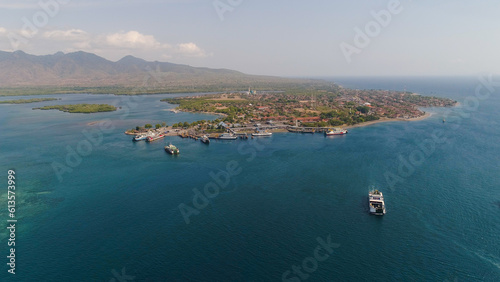 Aerial view ferry port gilimanuk with ferry boats, vehicles. Ferries transport vehicles and passengers in port. Port for departure from Bali to the island of Java.