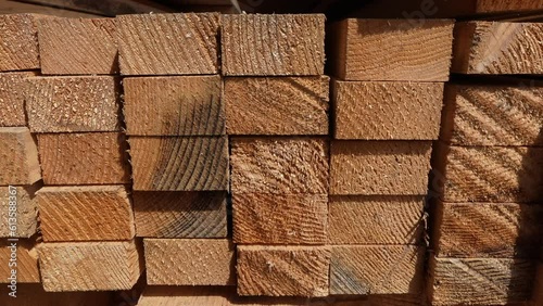 stack of Wooden boards lumber beams, industrial wood pine timber at warehouse