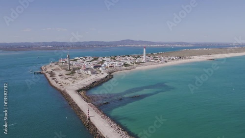 Aerial seascape view of Ilha do Farol (lighthouse island), in Algarve Tourism Destination Region, in Portugal south coast. photo