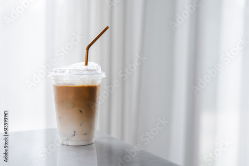 Plastic takeaway cups of delicious iced coffee on table in cafe , There is space for text in the background , 
