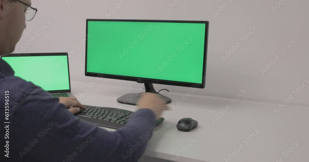 Businessman Working On A Personal Computer With Green Screen On Businessman Working On A Personal Computer With Green Screen On