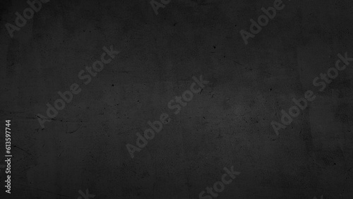 large dark black background image of rough raw concrete wall in loft style. modern black concrete wall decoration. cement floor texture use for background.