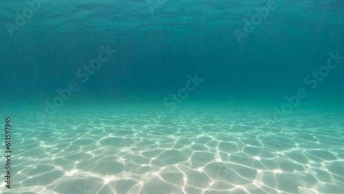 Underwater seascape sandy ocean floor with ripples of water surface in the Atlantic ocean, natural scene, Spain, Galicia