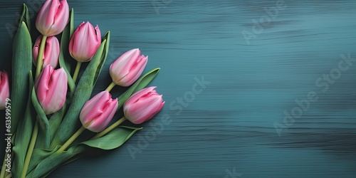 Vibrant tulip bouquet on a top view of blue wooden background  a burst of color and nature s beauty