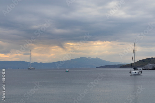 Kos island, boats, clouds, calm sea and air in a winter day view in Bodrum.