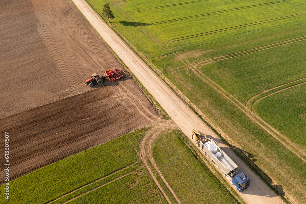 Drone photography of agricultural machinery getting ready for work