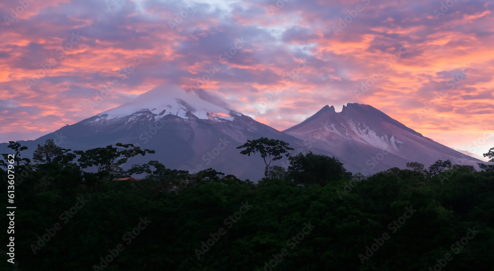 beautiful sunrise of a landscape with a volcano