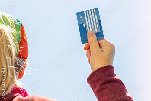 Obraz na płótnie European Health Insurance Card in hand for women, Concept, EU document confirming the right to treatment outside the country, Travel insurance. Holiday insurance for Europeans. w salonie