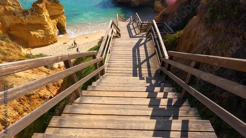 View of idyllic nature landscape with rocky cliff shore and waves crashing on. Camillo beach in Lagos. West Atlantic coast of Algarve region, south of Portugal.