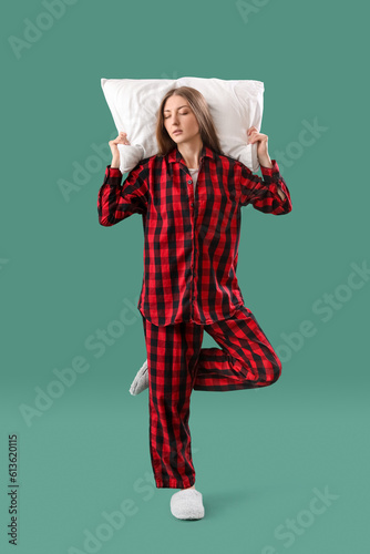 Young woman in pajamas with...
