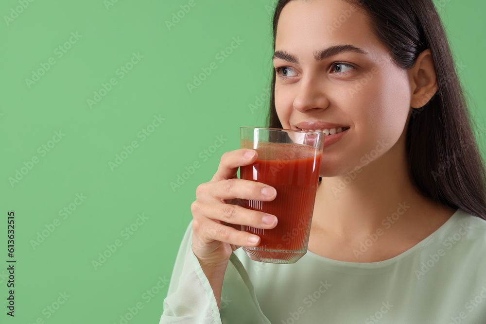 Young woman drinking vegetable juice on green background, closeup Young woman drinking vegetable juice on green background, closeup
