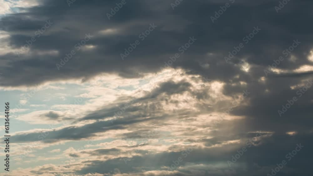 Incoming Storm Front. Time-Lapse. Against the backdrop of the setting sun, a storm front is rapidly advancing, creating a dramatic play of sunlight and growing darkness Incoming Storm Front. Time-Lapse. Against the backdrop of the setting sun, a storm front is rapidly advancing, creating a dramatic play of sunlight and growing darkness