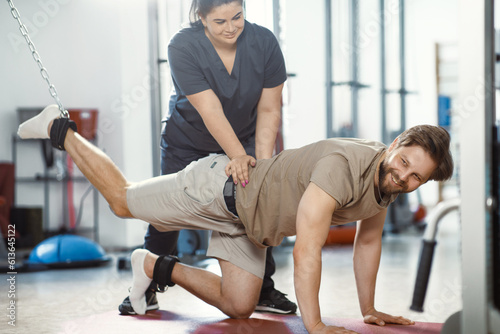 Rehabilitation therapy  therapeutic exercises  back strengthening  physical therapy. Rehabilitation approach for individuals with injuries. Therapeutic strategies for injury recovery. Restorative care