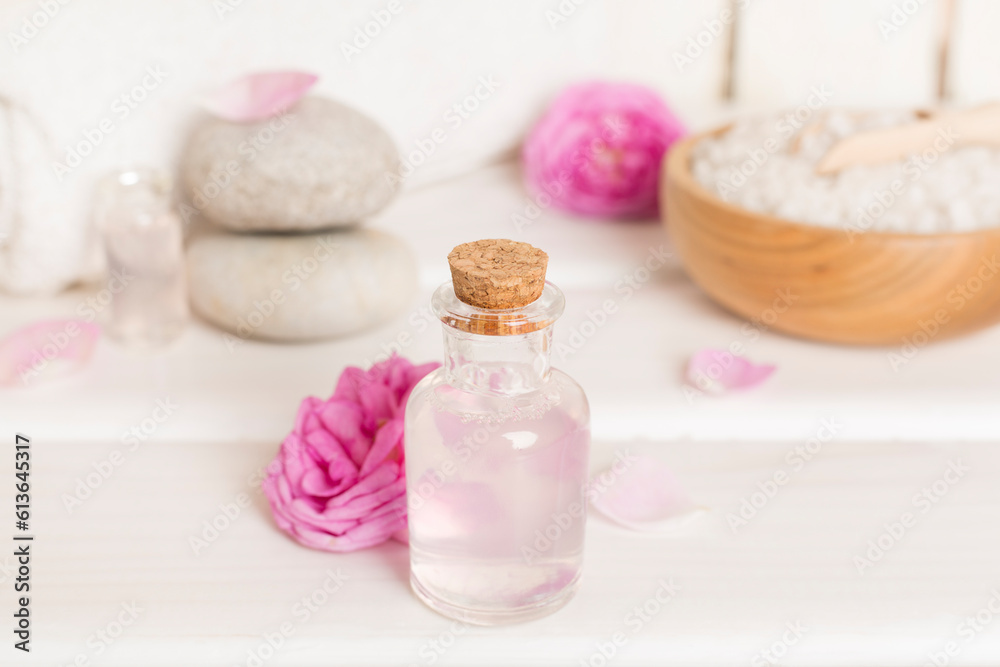 Spa composition with pink roses on wooden table Spa composition with pink roses on wooden table