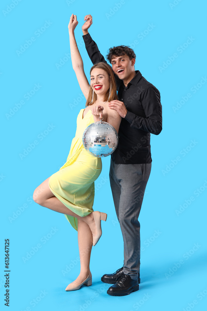 Beautiful prom couple with disco ball on blue background Stock Photo ...