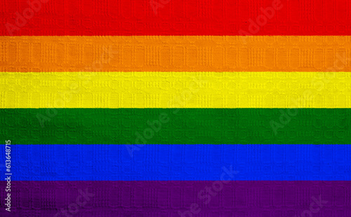 Flag of the LGBT community on the background of a fabric texture. Rainbow symbol of gay culture. Concept collage. Illustration symbol of pride.