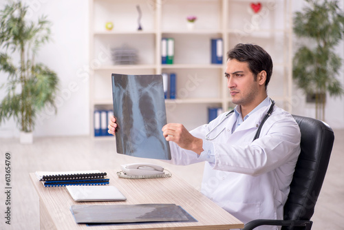 Wallpaper Mural Young male doctor radiologist working in the clinic Torontodigital.ca