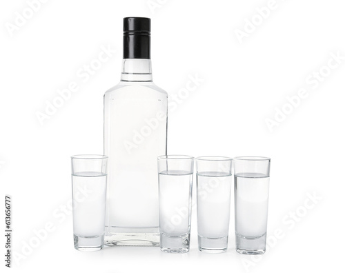 Bottle and glasses of vodka isolated on white background