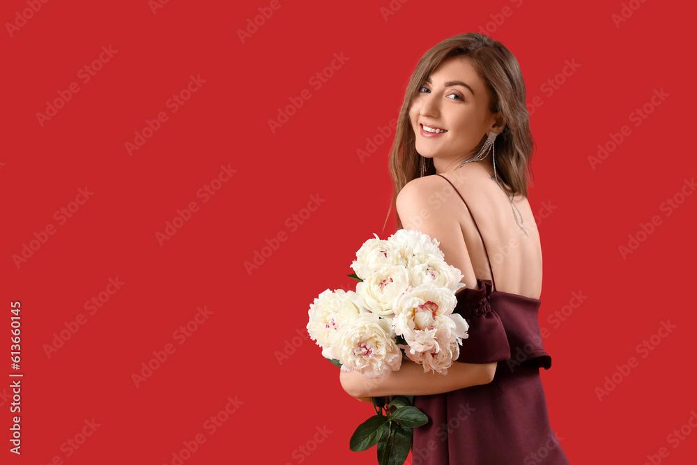 Beautiful young woman with bouquet of peony flowers on red background Beautiful young woman with bouquet of peony flowers on red background