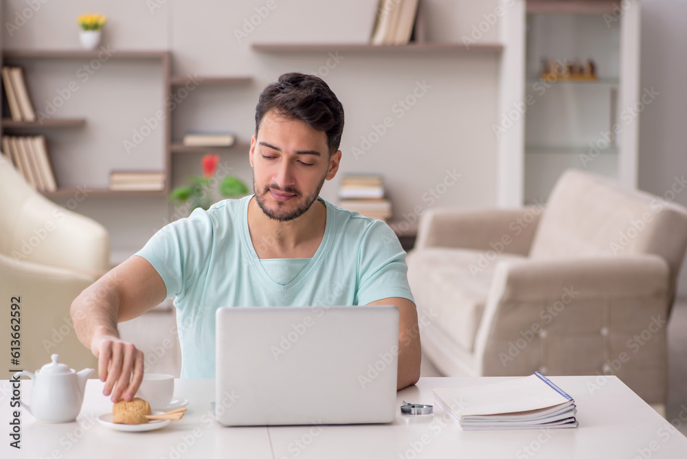 Young male freelancer working from home Young male freelancer working from home